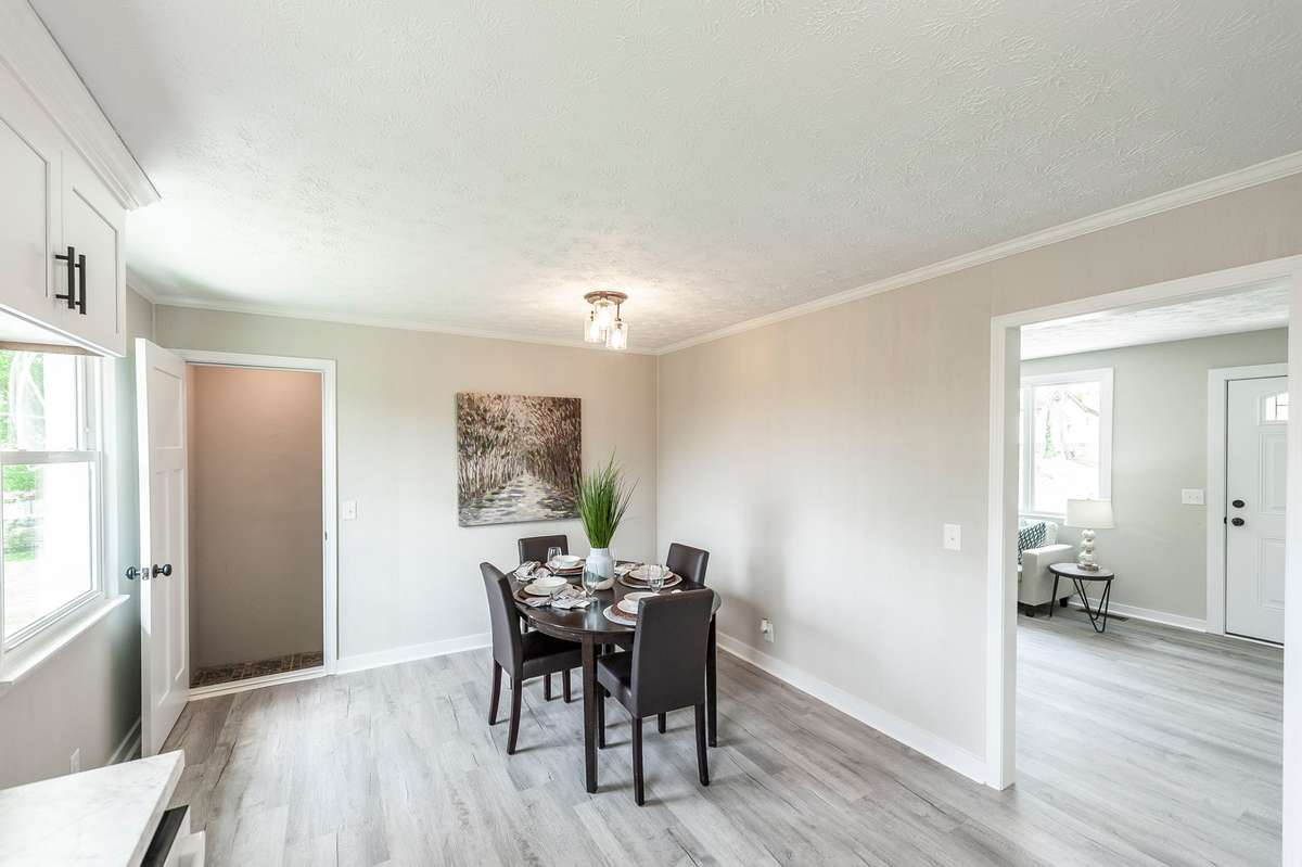 The cozy eat-in dining nook offers a bright & welcoming space for casual meals & everyday gatherings.