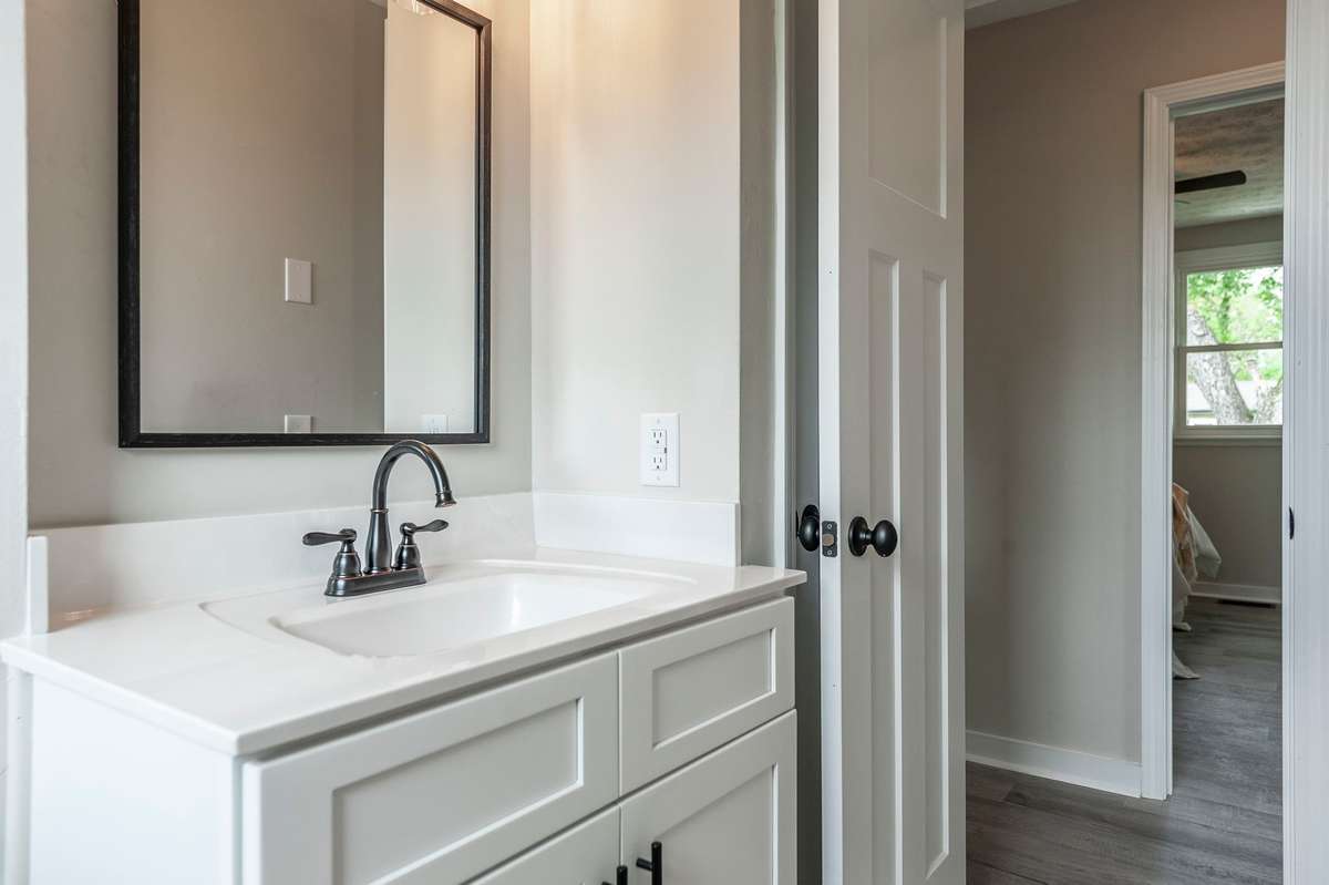 Conveniently located near all three bedrooms, this updated bath offers easy access for everyday comfort & practicality.