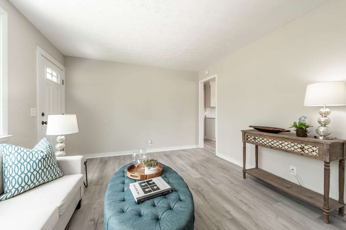 This living area is ideal for both relaxing evenings & entertaining guests with its generous proportions & easy flow.