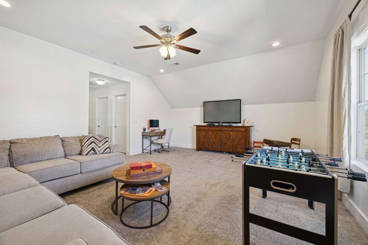 Media room, home-school desk area, yoga or gym spot, or maybe an additional set of beds for sleepovers and visitors, this area is very functional to accommodate your needs.  The two doors lead to a closet and the laundry room.