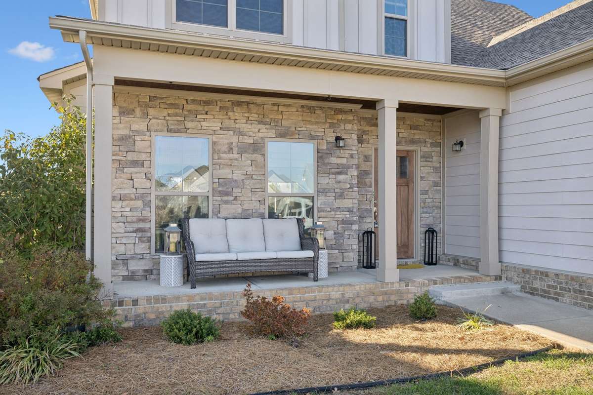 Relax and unwind on the inviting front porch — the perfect spot to enjoy a quiet morning coffee or evening breeze, and wave "hello" to the neighbors out walking.  The Hereford Farms neighborhood offers a walking path for everyone to enjoy.