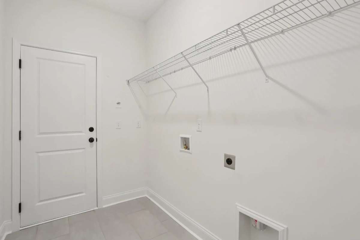 Blake utility room entry from garage. Photos of similar home, same plan. Options may vary.