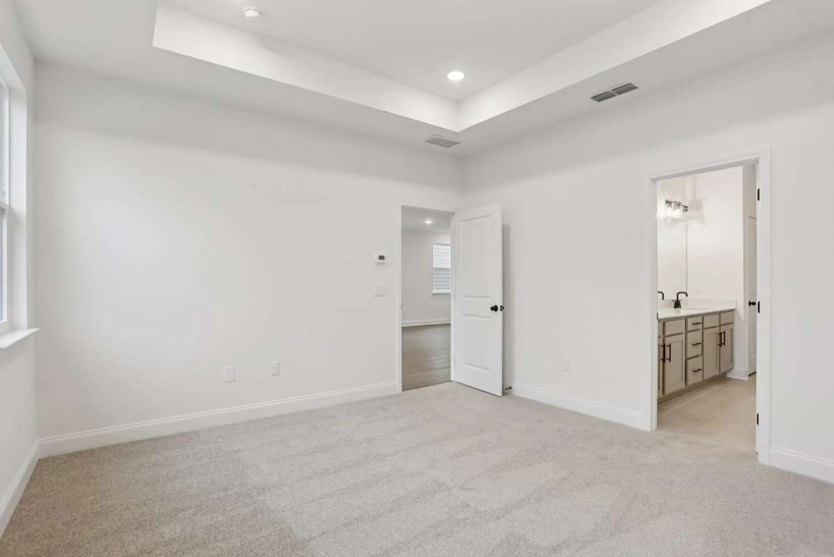 Blake first floor primary bedroom. Photos of similar home, same plan. Options may vary.