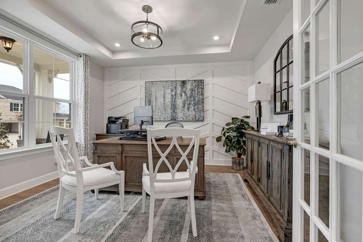 Stock Model Photo. Dedicated Study with included tray ceiling and French Doors!