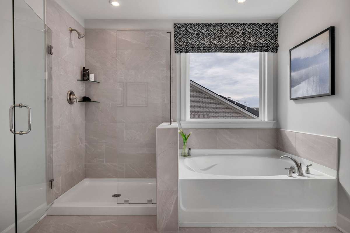 Stock Model Photo. Primary Bathroom with walk-in shower and separate tub or choose an oversized shower at no additional cost!