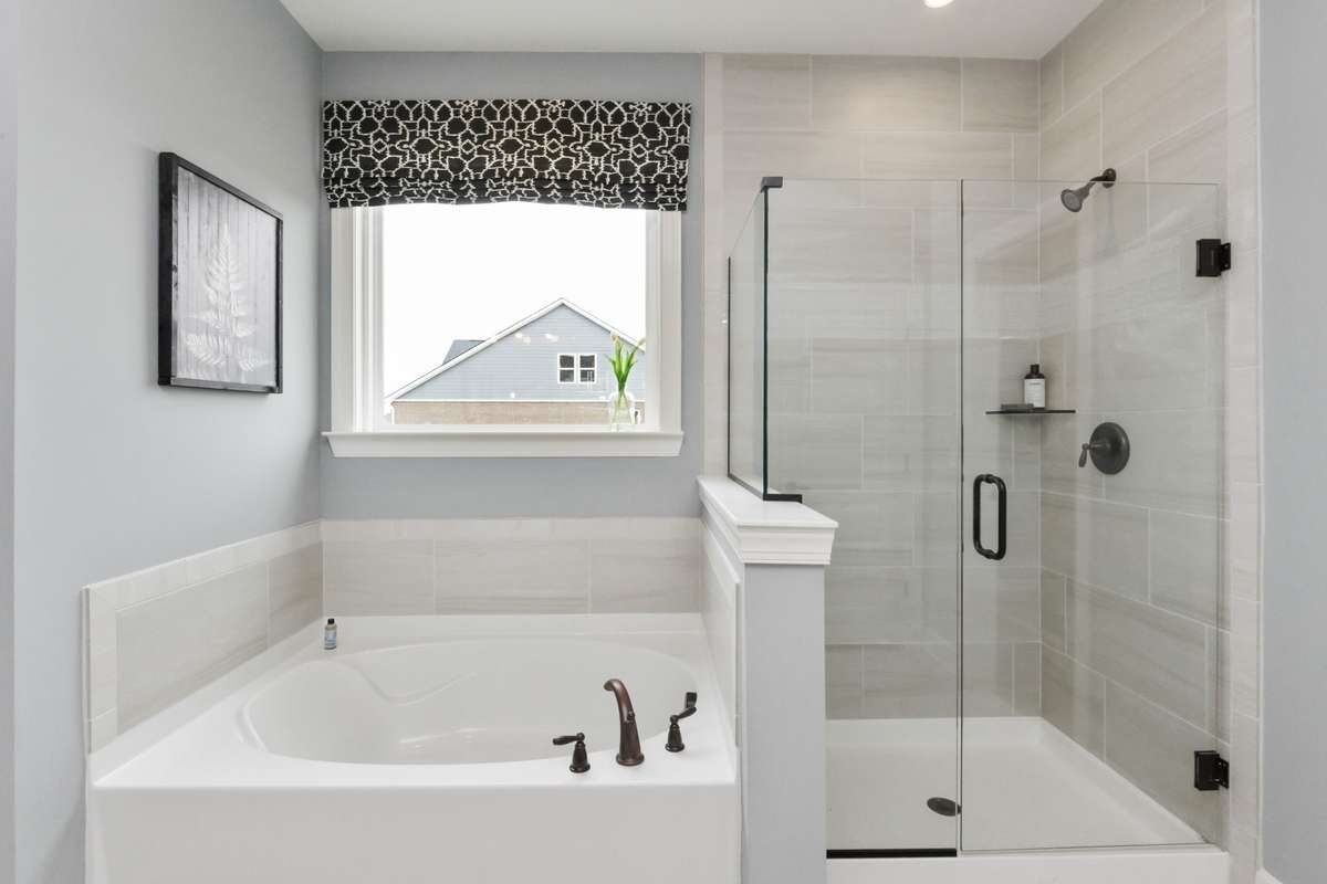 Primary suite features double vanities, tile floors, and tiled shower or tiled shower/garden tub at NO cost!