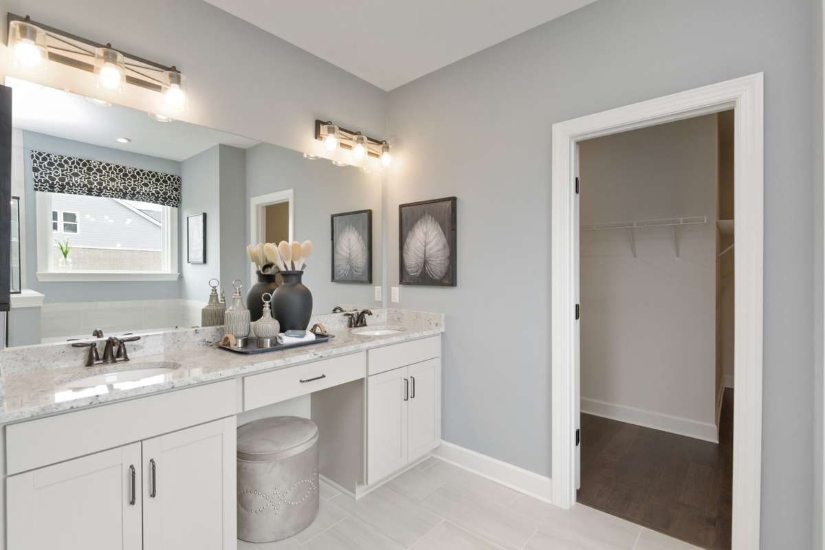 Primary suite features double vanities, tile floors, and tiled shower or tiled shower/garden tub at NO cost!