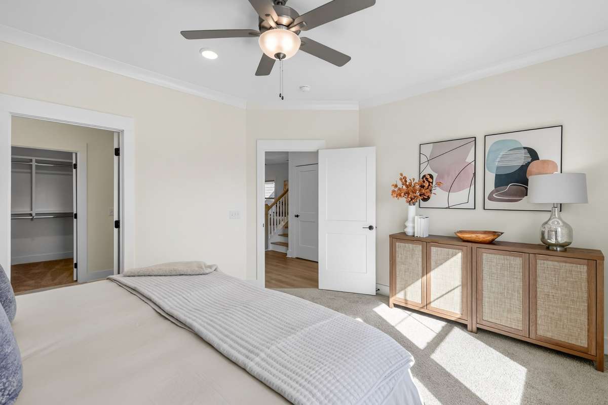**Photos not of the actual home but of another Everleigh floor plan in The Knoll at Fairvue. Pictures to show the layout of the Owners bedroom on the main level staged with furniture.**