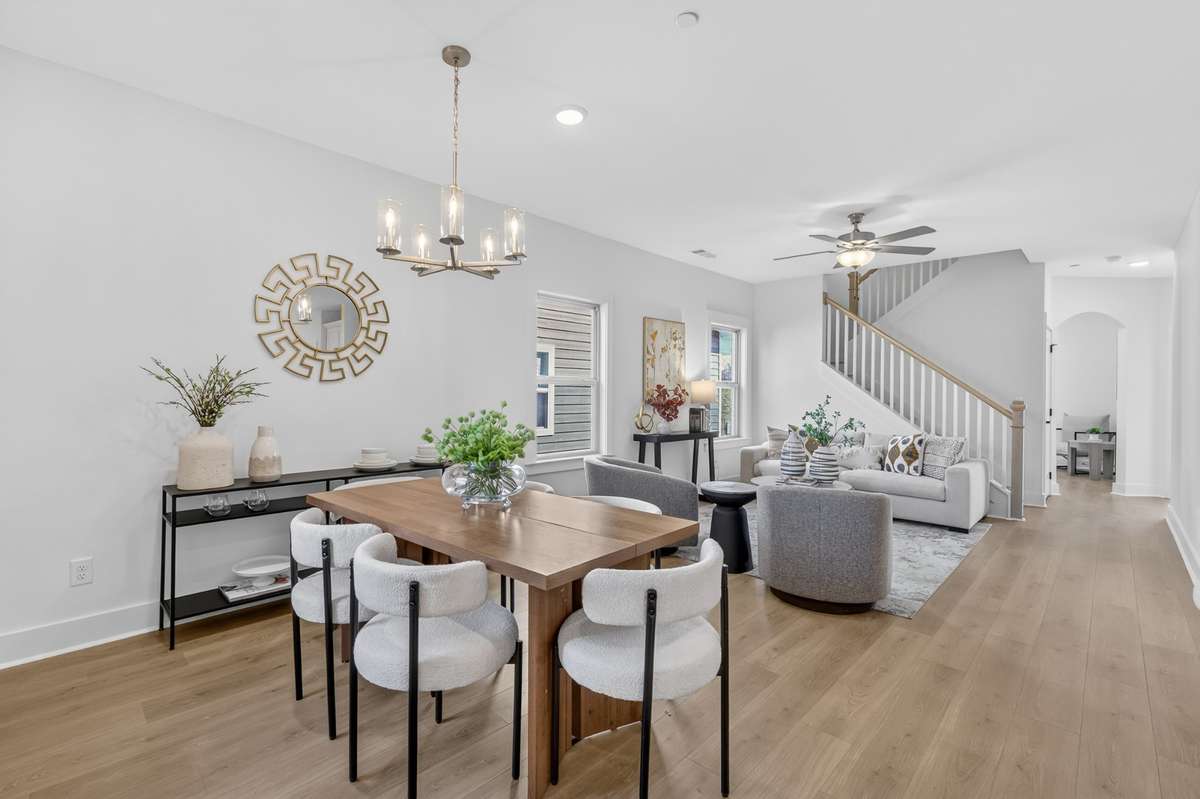 **Photos not of the actual home but of another Everleigh floor plan in The Knoll at Fairvue. Pictures to show the living and dining layout of the floor plan staged with furniture.**