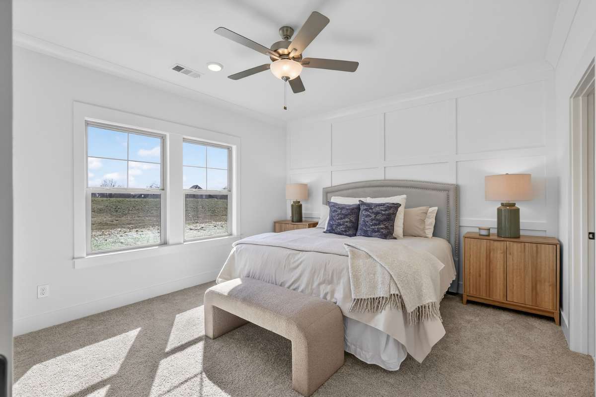 **Photos not of the actual home but of another Everleigh floor plan in The Knoll at Fairvue. Pictures to show the layout of the Owners bedroom on the main level staged with furniture.**