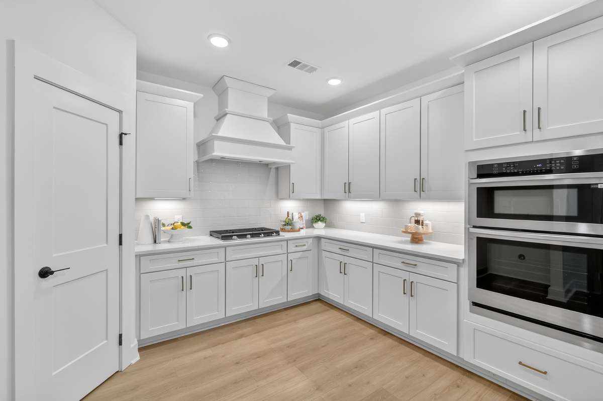**Photos not of the actual home but of another Everleigh floor plan in The Knoll at Fairvue. Pictures to show the layout of the kitchen.**
