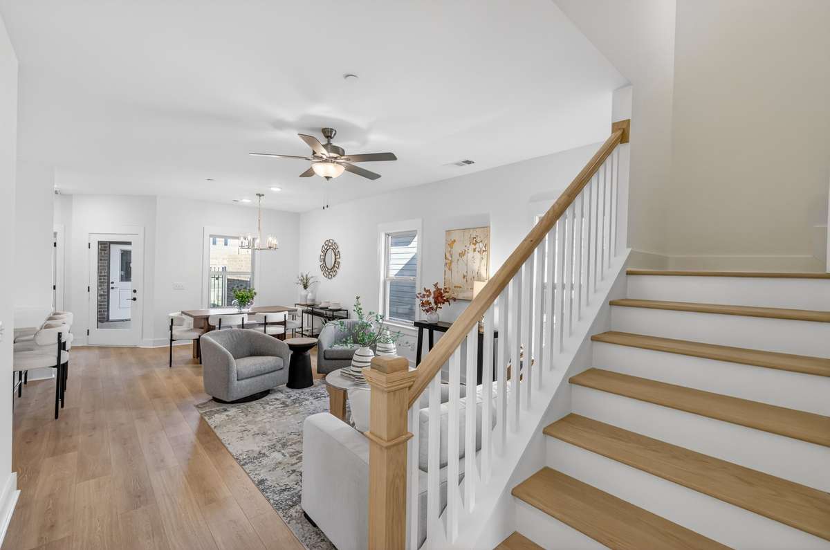 **Photos not of the actual home but of another Everleigh floor plan in The Knoll at Fairvue. Pictures to show the living and dining layout of the floor plan staged with furniture.**