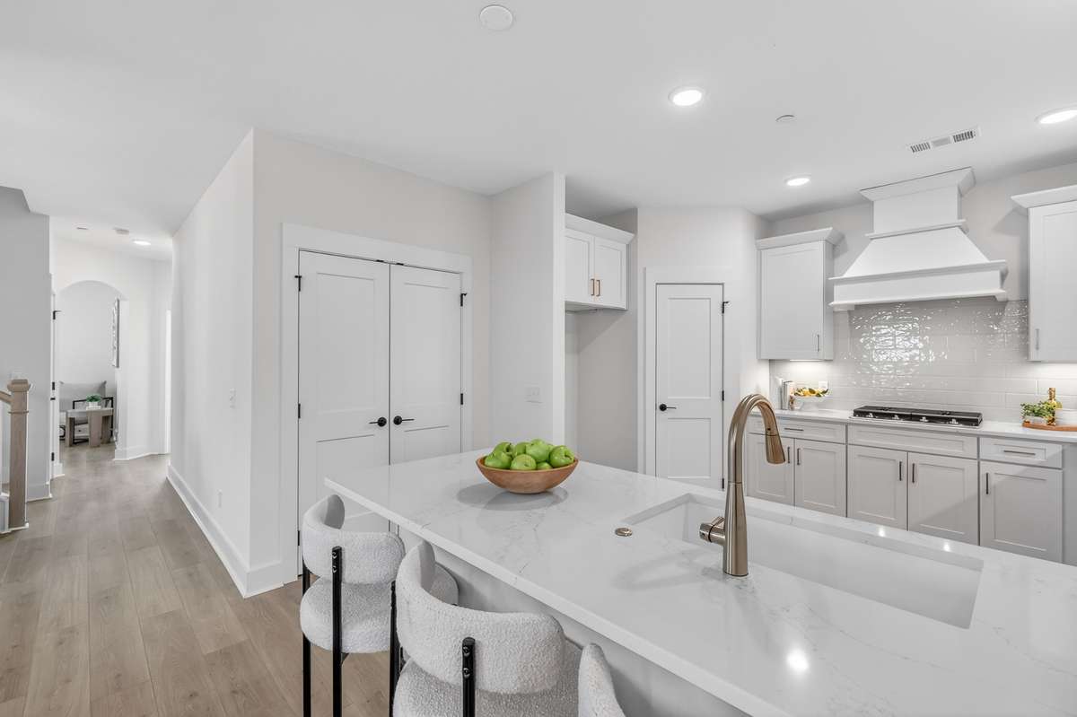 **Photos not of the actual home but of another Everleigh floor plan in The Knoll at Fairvue. Pictures to show the layout of the kitchen.**