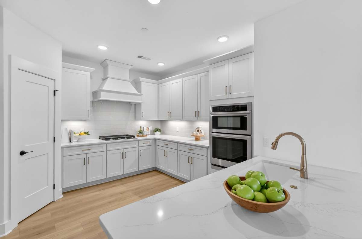 **Photos not of the actual home but of another Everleigh floor plan in The Knoll at Fairvue. Pictures to show the layout of the kitchen.**