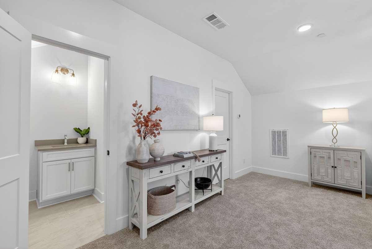 **Photos not of the actual home but of another Everleigh floor plan in The Knoll at Fairvue. Pictures to show the layout of bedroom 3 on the second level staged with furniture.**