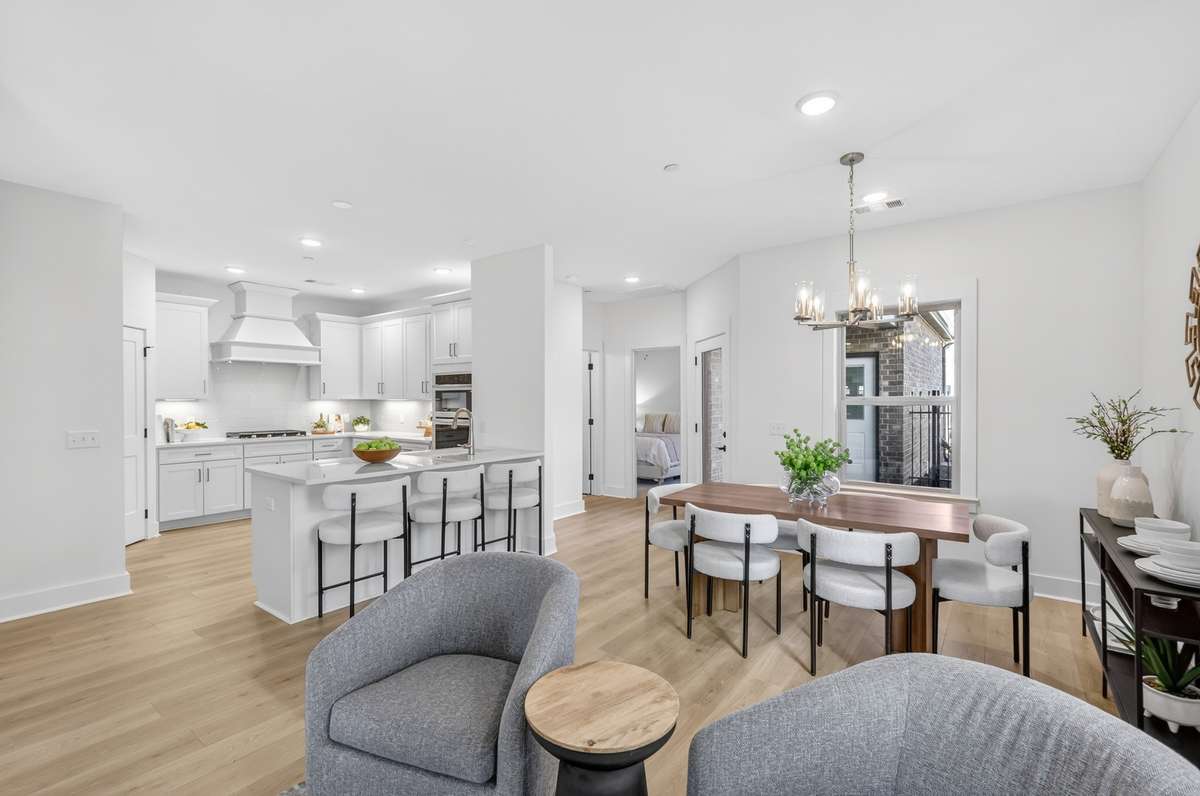 **Photos not of the actual home but of another Everleigh floor plan in The Knoll at Fairvue. Pictures to show the living and dining layout of the floor plan staged with furniture.**