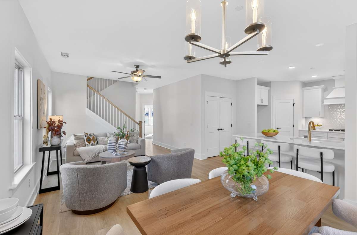 **Photos not of the actual home but of another Everleigh floor plan in The Knoll at Fairvue. Pictures to show the living and dining layout of the floor plan staged with furniture.**