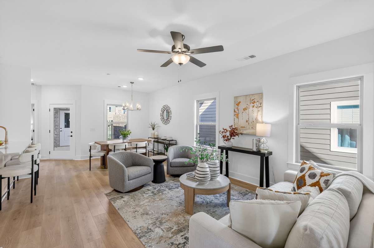 **Photos not of the actual home but of another Everleigh floor plan in The Knoll at Fairvue. Pictures to show the living and dining layout of the floor plan staged with furniture.**