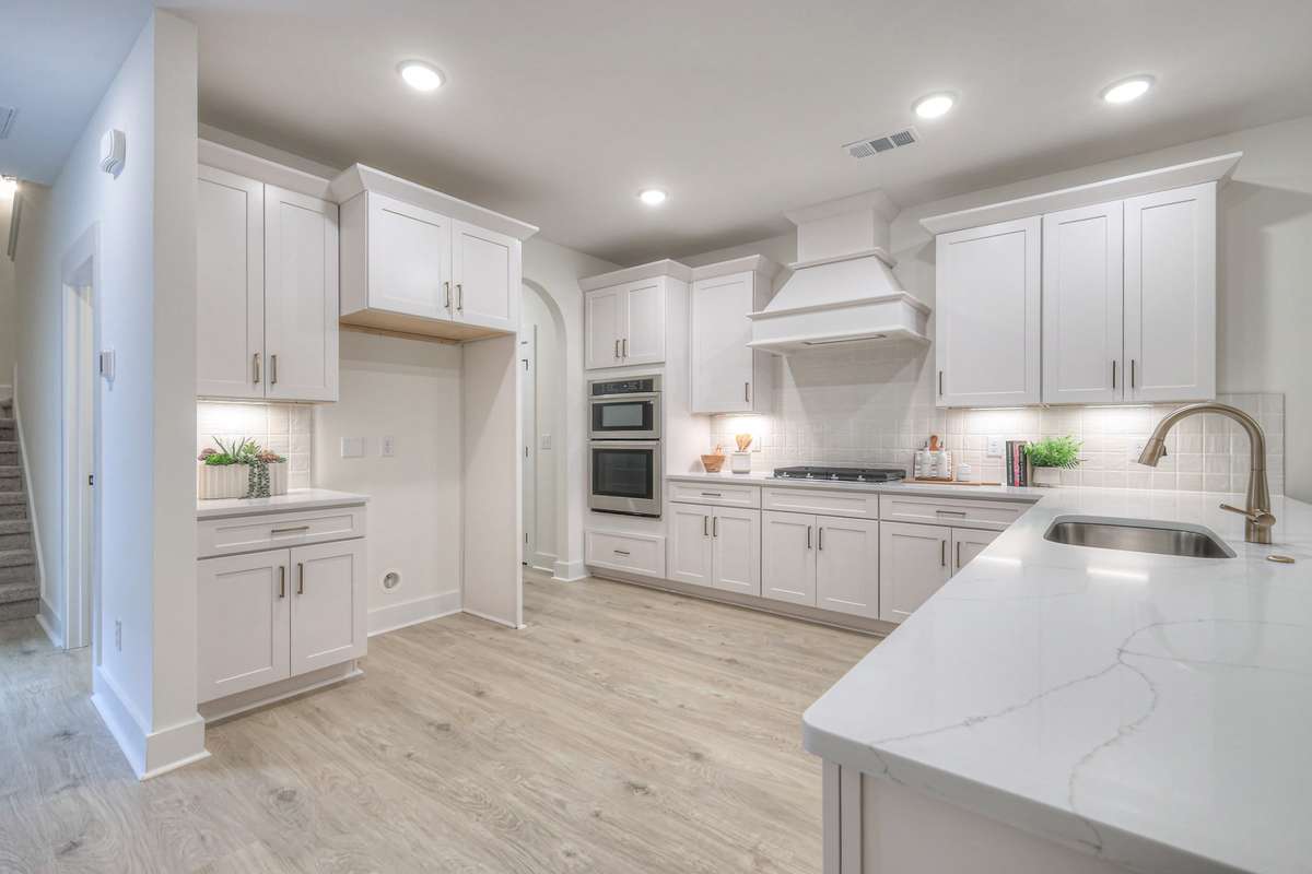 **Photos not of the actual home but of another Ashleigh floor plan in The Knoll at Fairvue. Pictures to show the layout of the kitchen.**
