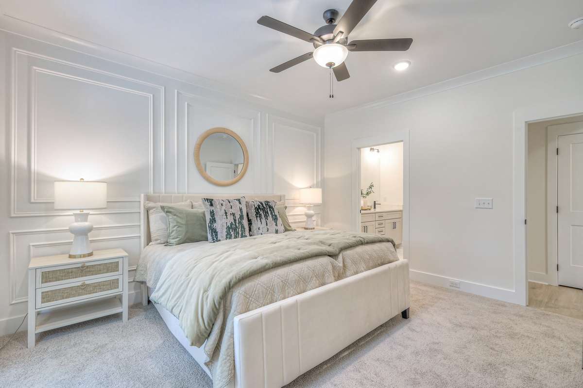 **Photos not of the actual home but of another Ashleigh floor plan in The Knoll at Fairvue. Pictures to show the layout of the Owners bedroom on the main level staged with furniture.**