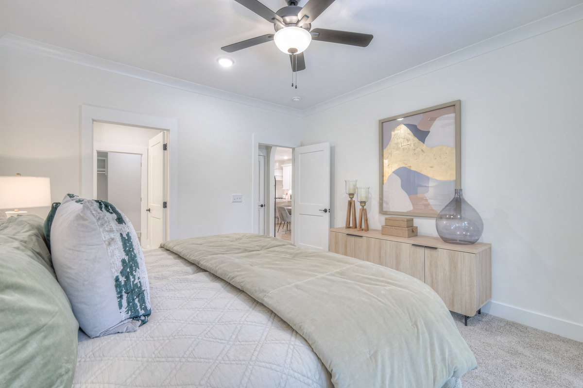 **Photos not of the actual home but of another Ashleigh floor plan in The Knoll at Fairvue. Pictures to show the layout of the Owners bedroom on the main level staged with furniture.**