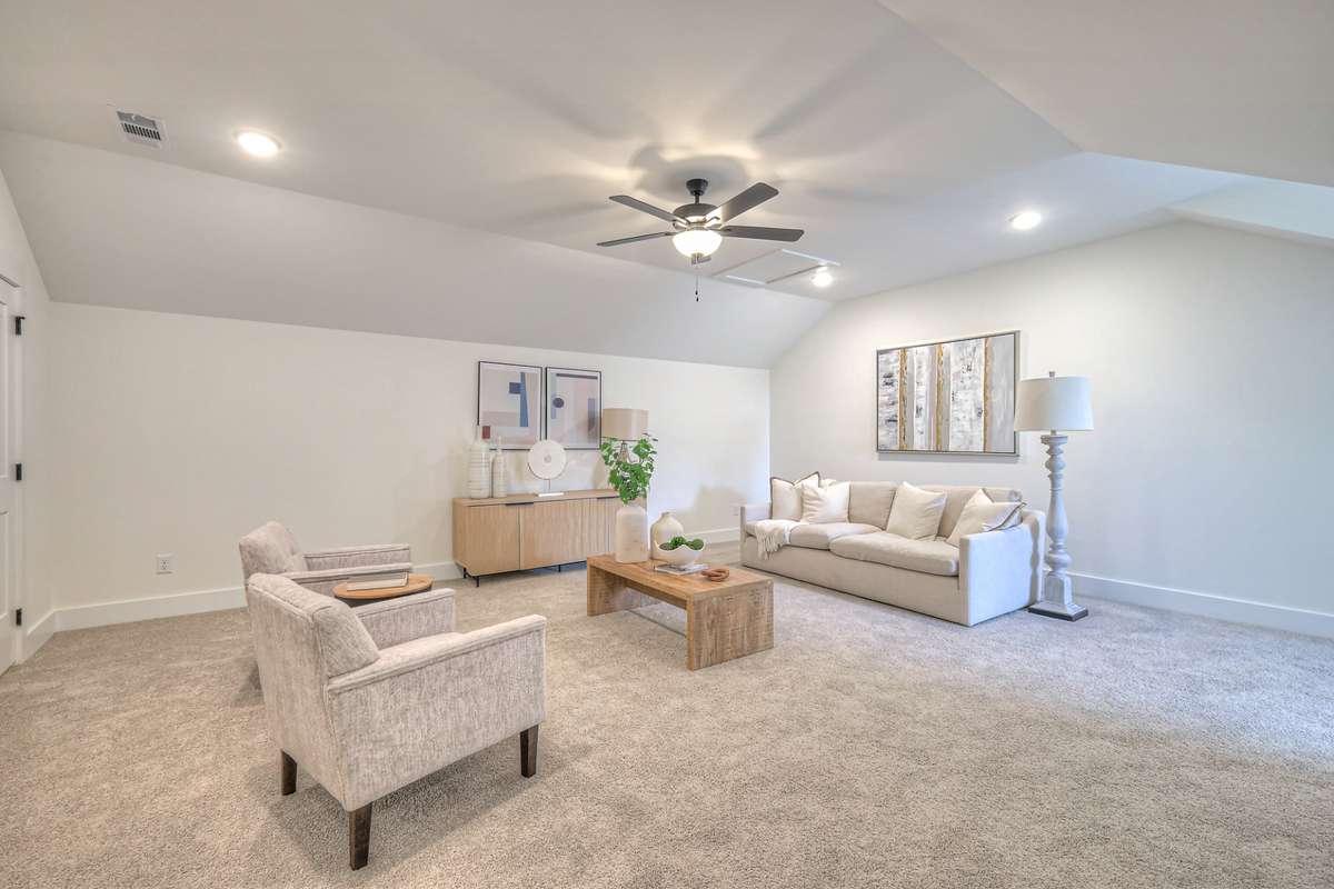 **Photos not of the actual home but of another Ashleigh floor plan in The Knoll at Fairvue. Pictures to show the layout of bedroom 3 on the second level staged with furniture.**
