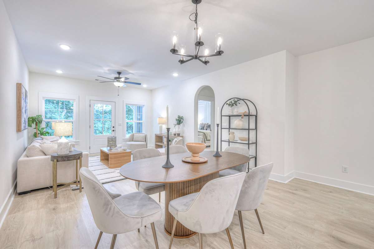 **Photos not of the actual home but of another Ashleigh floor plan in The Knoll at Fairvue. Pictures to show the layout of the living room and dining room staged with furniture.**
