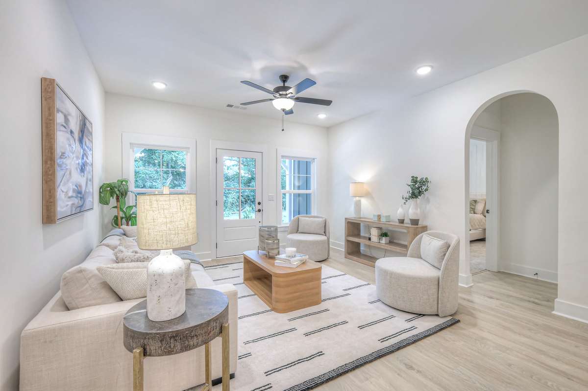**Photos not of the actual home but of another Ashleigh floor plan in The Knoll at Fairvue. Pictures to show the layout of the living room staged with furniture.**