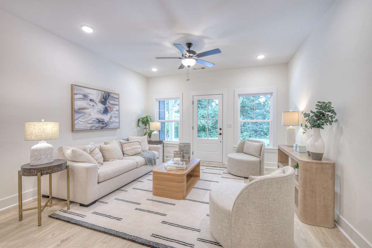 **Photos not of the actual home but of another Ashleigh floor plan in The Knoll at Fairvue. Pictures to show the layout of the living room staged with furniture.**