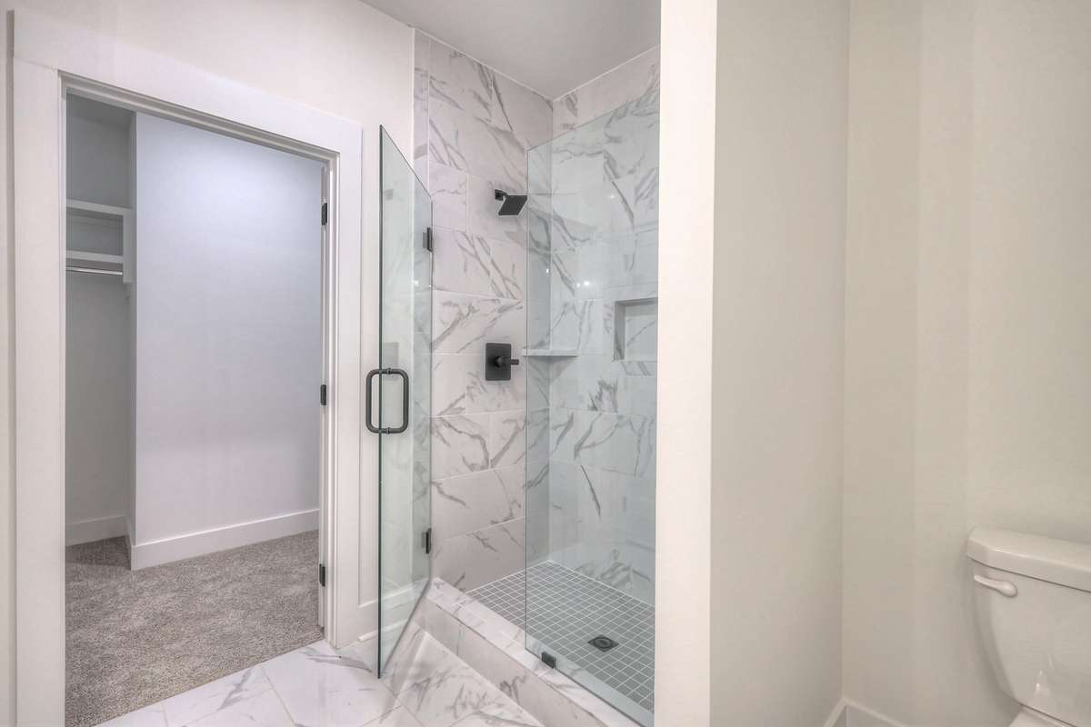 **Photos not of the actual home but of another Ashleigh floor plan in The Knoll at Fairvue. Pictures to show the layout of the Owners shower on the main level."