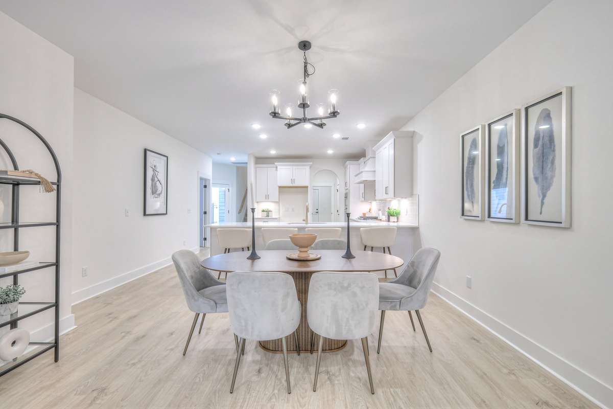 **Photos not of the actual home but of another Ashleigh floor plan in The Knoll at Fairvue. Pictures to show the layout of the dining room staged with furniture.**