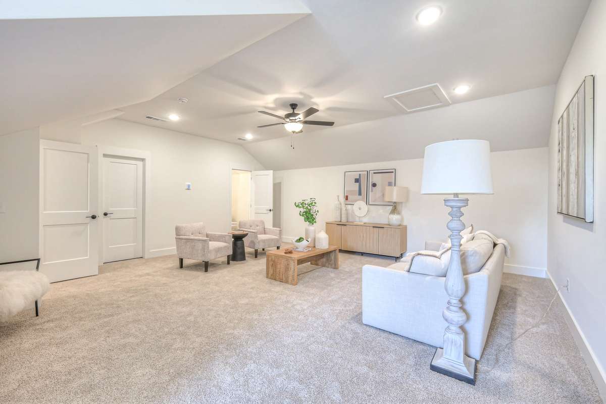**Photos not of the actual home but of another Ashleigh floor plan in The Knoll at Fairvue. Pictures to show the layout of bedroom 3 on the second level staged with furniture.**