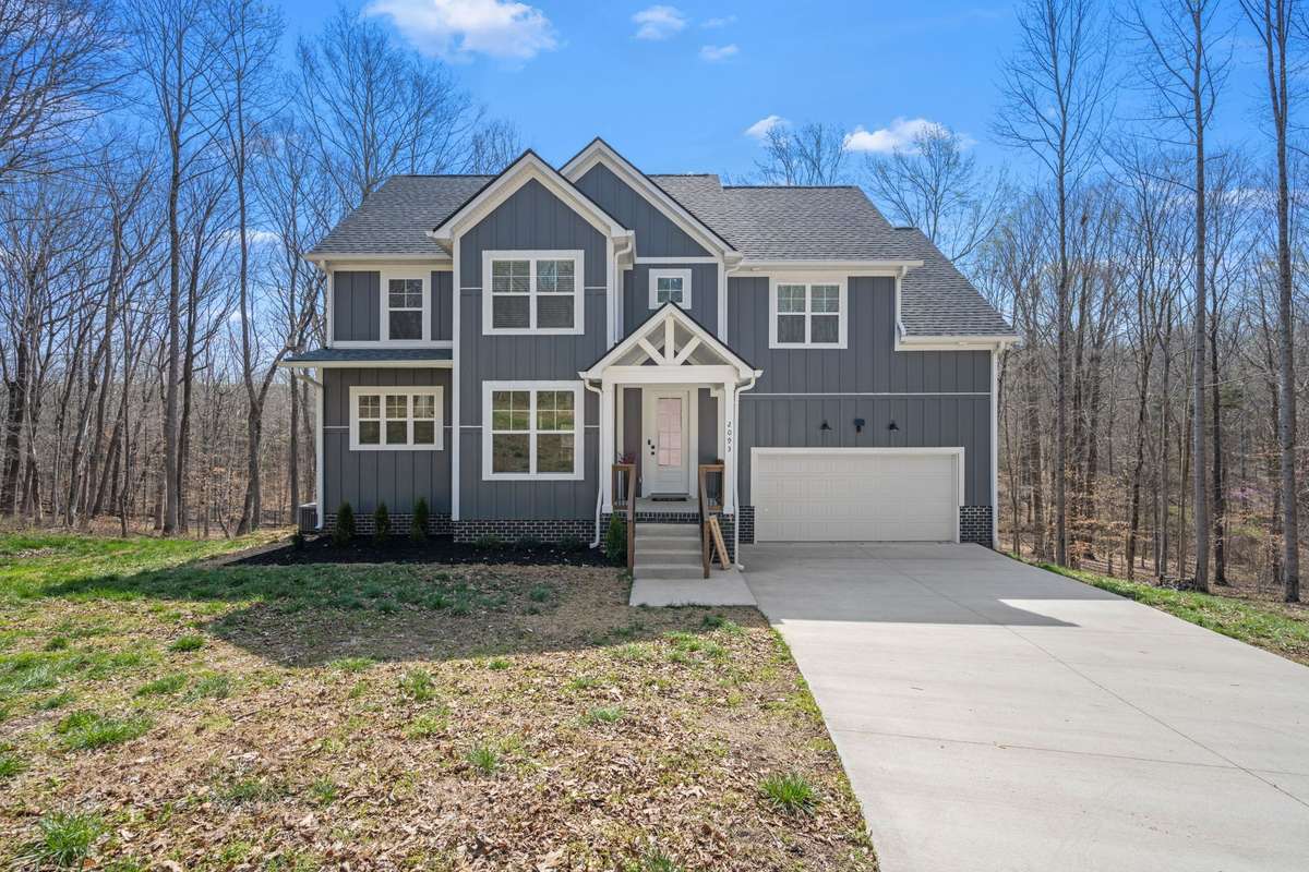 The front of the home with space and privacy all around.