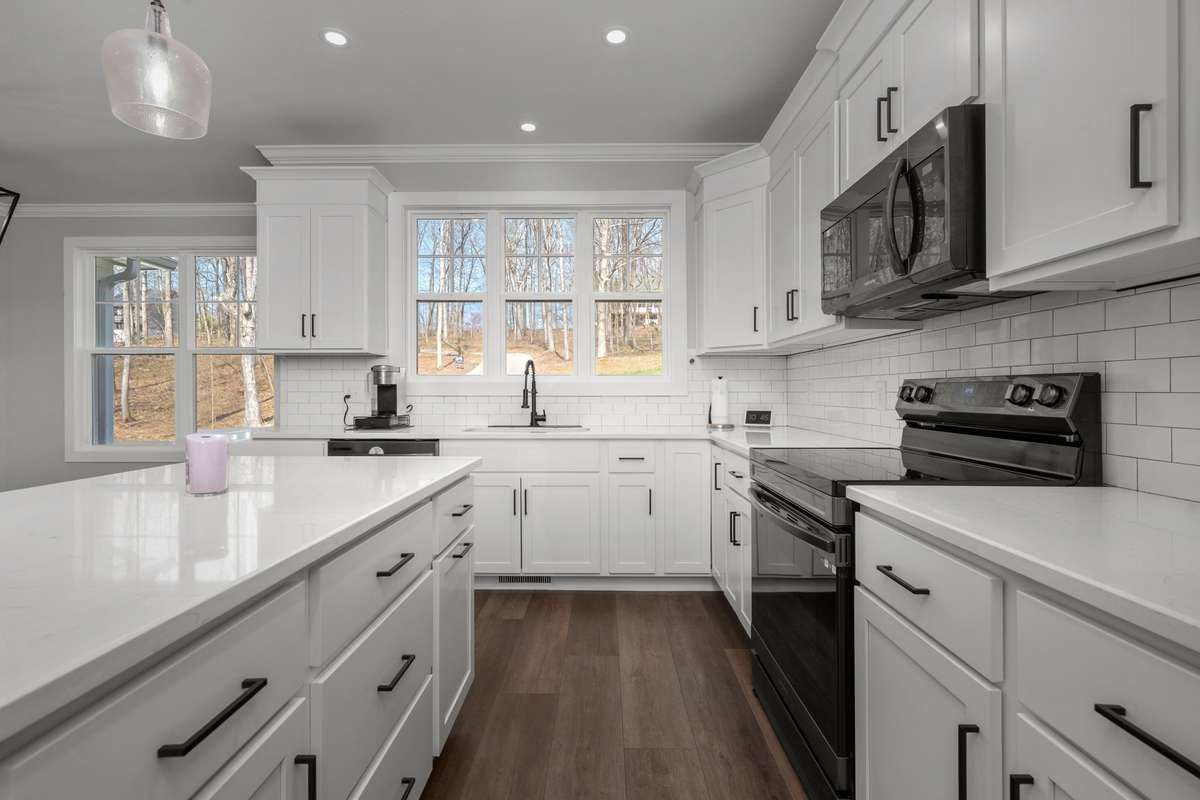 From the island, a view to the sink with natural light from the window.