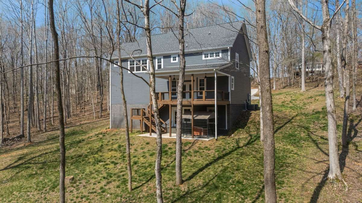 A wider look at the back of the home and all the space around it.