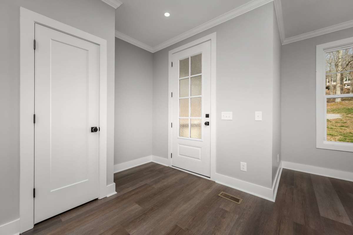 Functional entryway with coat closet for everyday use.