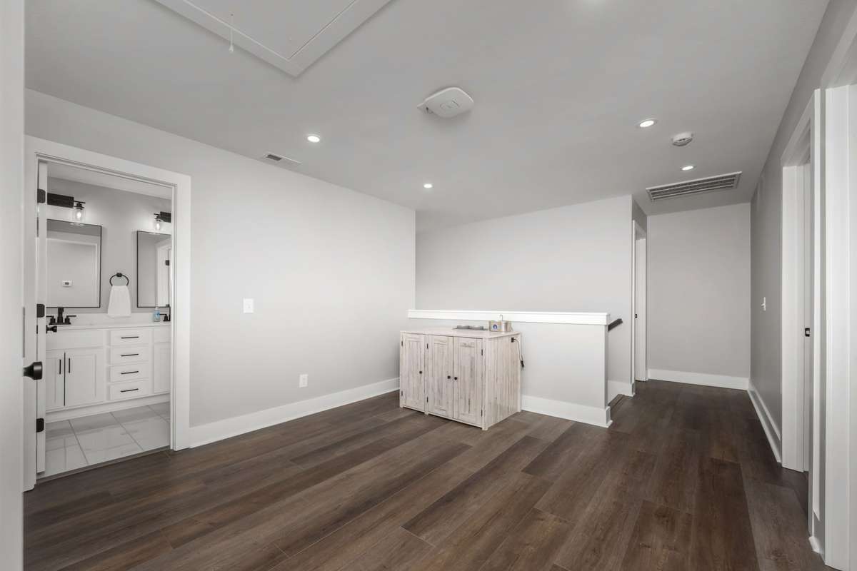 Second-floor landing with room for a sitting or work area.