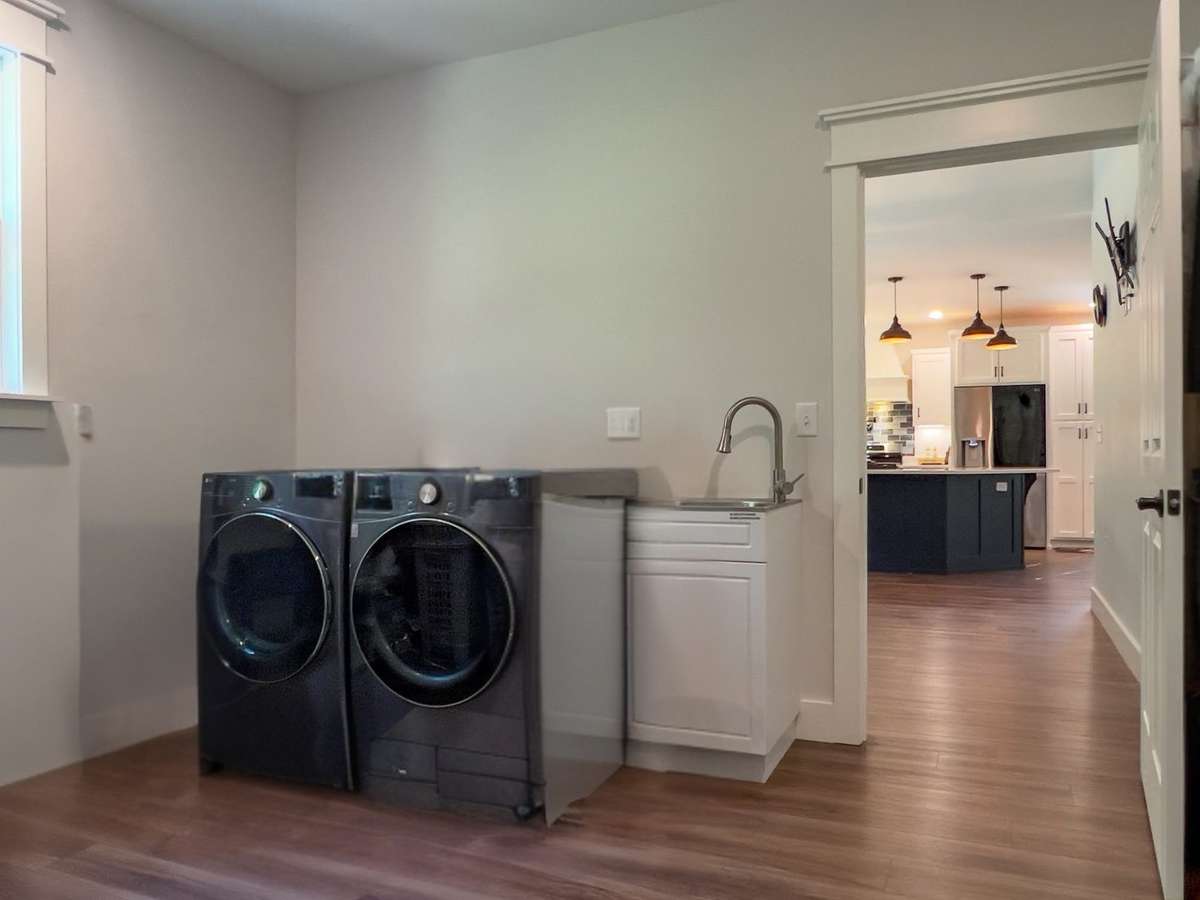 Laundry room located just off the dining area is the perfect size! Door leading to Garage offers ease to unload those groceries!