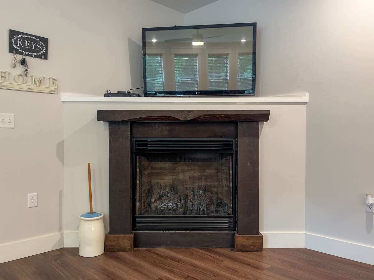 Gas Fireplace with Custom Hand Hewn Oak Mantle - Wood harvested from property
