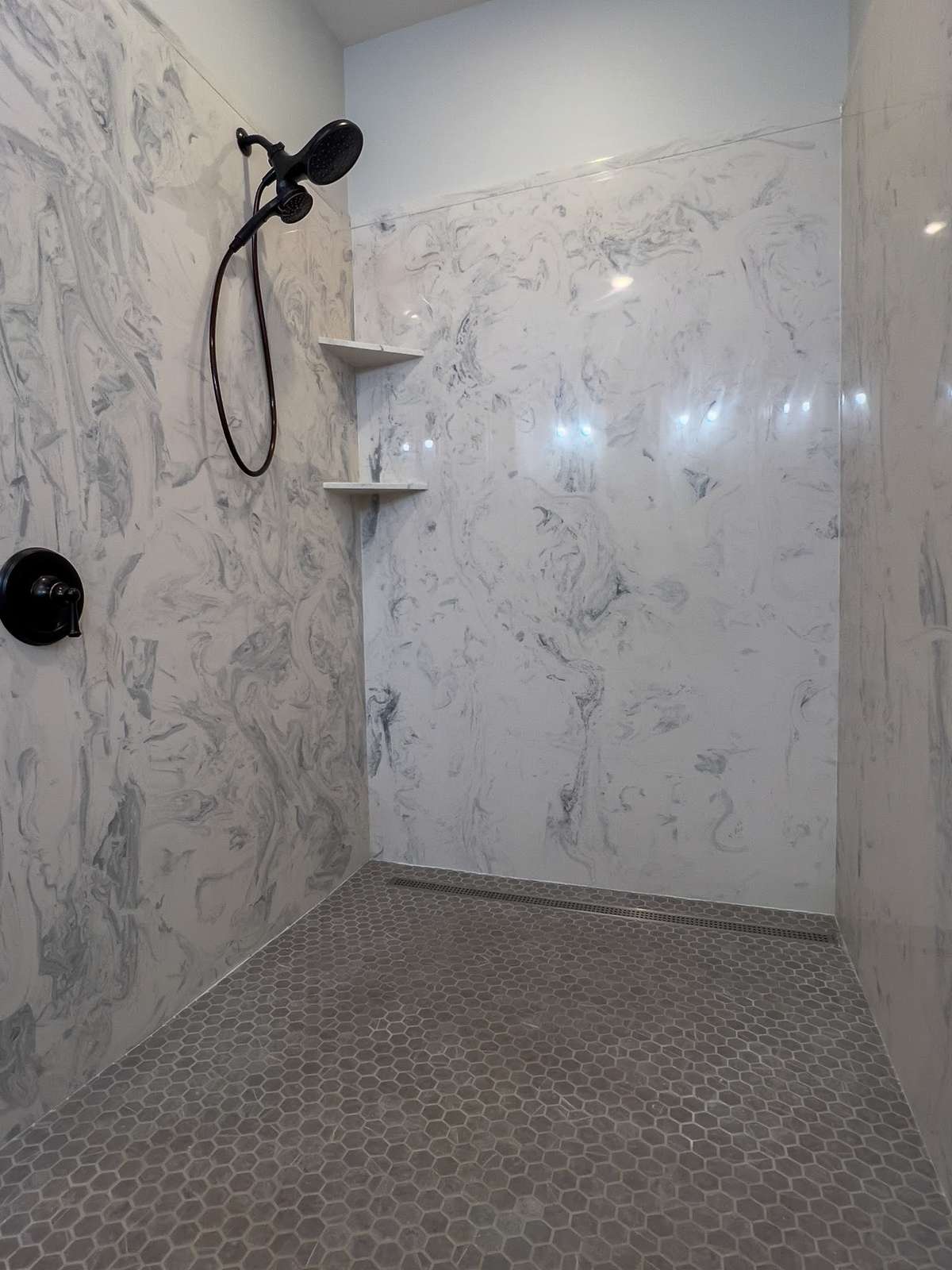Walk-In Primary Shower - Spacious and well thought out plan for future wheel chair accessibility.