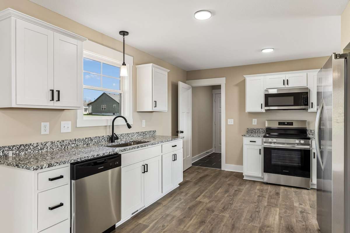 Sample photos from a previous build showing the Braxton Floor Plan.  Materials and colors are subject to change without notice.