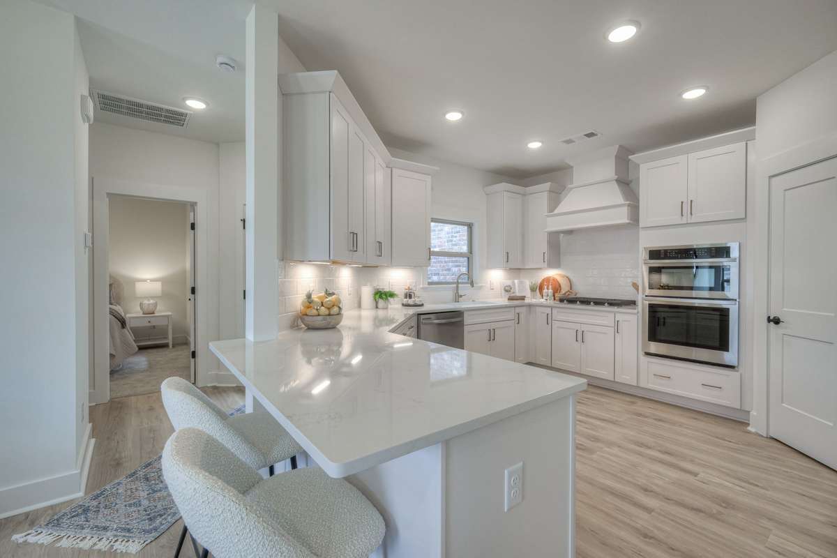 **Photos not of the actual home but of the Raleigh model home in The Knoll at Fairvue. Pictures to show the layout of the kitchen.**
