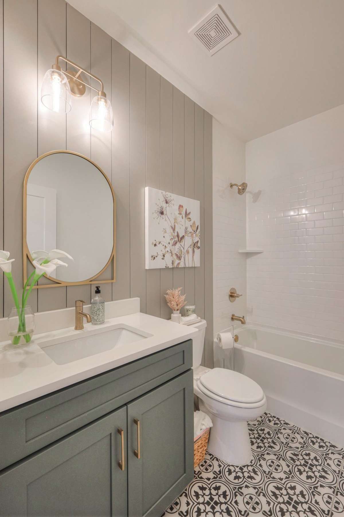 **Photos of the model home secondary bathroom on the main level to show the layout of the floor plan staged with furniture. Not the actual house.**