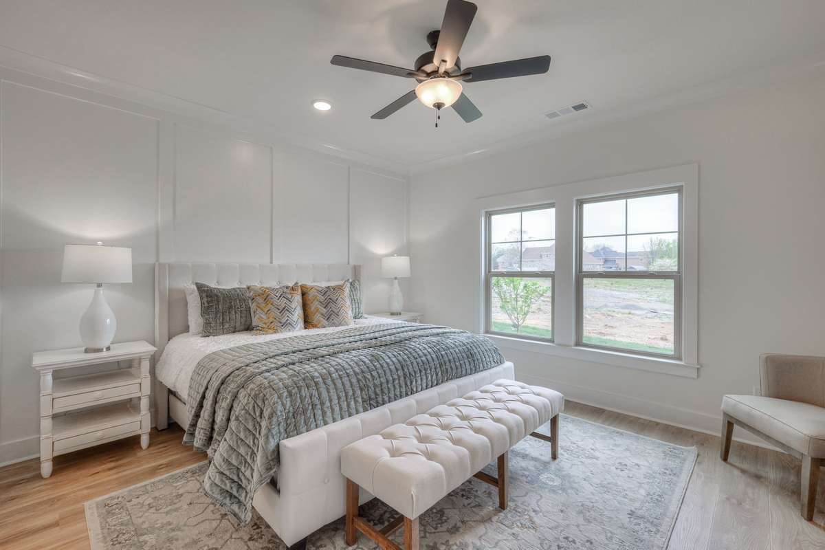 **Photos of the model home owners bedroom on the main level to show the layout of the floor plan staged with furniture. Not the actual house.**