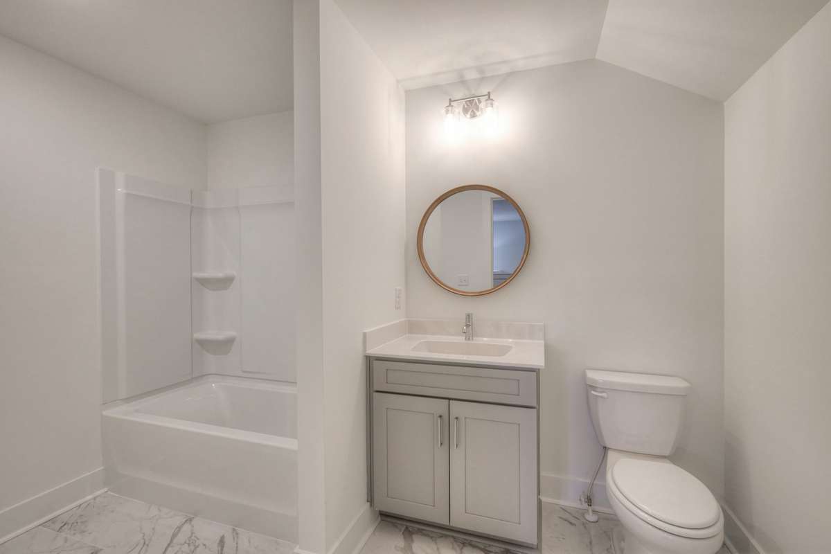 **Photos of the model home 3rd bathroom upstairs to show the layout of the floor plan staged with furniture. Not the actual house.**