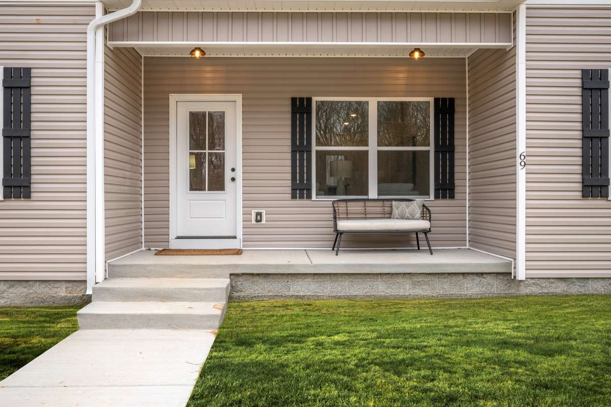 Covered Front Porch + Concrete Sidewalk