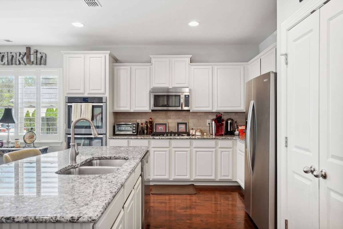 The sink at the island allows you to be part of your gatherings when entertaining or just enjoying a night at home.
