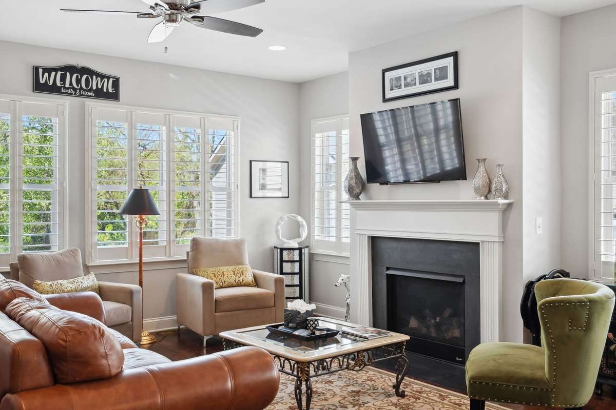 This living room features a gas fireplace adding to its coziness.