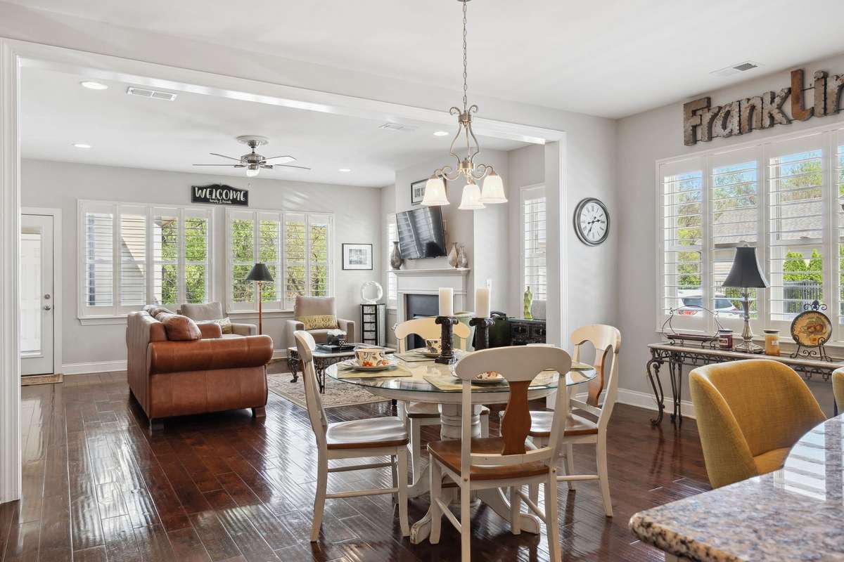 The dining space features a large 3 panel window and flows perfectly into the living room.
