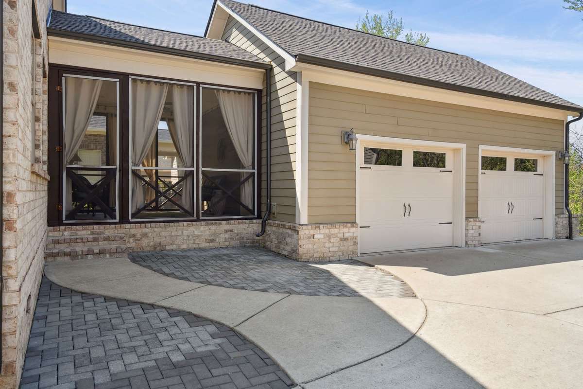 Delightful enclosed breezeway leading to the 2 car garage.